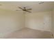 Unfinished bedroom featuring ceiling fan and door to closet at 7117 Hubner Pl # 22, Cary, NC 27519