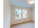 Well-lit bedroom with bright windows offering a view of the outdoors at 7117 Hubner Pl # 22, Cary, NC 27519