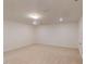 A spacious bedroom offers neutral carpet and walls with recessed lighting at 7117 Hubner Pl # 22, Cary, NC 27519