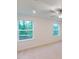 Bedroom featuring carpet, ceiling fan, and plenty of natural light from the backyard view at 7117 Hubner Pl # 22, Cary, NC 27519