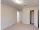 Carpeted bedroom offers closet and transition to other rooms in the home at 7117 Hubner Pl # 22, Cary, NC 27519