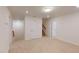 An open bedroom offers access to stairs and hallway at 7117 Hubner Pl # 22, Cary, NC 27519