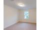 Bright bedroom with neutral carpet and a window offering natural light at 7117 Hubner Pl # 22, Cary, NC 27519