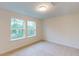 Spacious bedroom with large windows bringing in ample natural light at 7117 Hubner Pl # 22, Cary, NC 27519