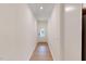 Hallway leading to the front door has wood floors and recessed lights at 7117 Hubner Pl # 22, Cary, NC 27519