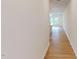 Wood floors in hallway provides access to kitchen and living area at 7117 Hubner Pl # 22, Cary, NC 27519