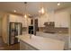 Modern kitchen featuring stainless steel appliances, a quartz countertop, and pendant lighting at 7117 Hubner Pl # 22, Cary, NC 27519