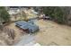 Aerial view of a gray house with a large yard at 7228 Pecan Tree St, Willow Springs, NC 27592