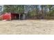 Spacious backyard with detached shed and fire pit at 7228 Pecan Tree St, Willow Springs, NC 27592