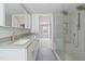 Modern bathroom with double vanity and glass shower at 7228 Pecan Tree St, Willow Springs, NC 27592