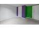 Bedroom with purple and green walls at 7228 Pecan Tree St, Willow Springs, NC 27592