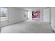 Bedroom with pink accent wall and gray carpeting at 7228 Pecan Tree St, Willow Springs, NC 27592