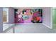 Bedroom with large mural and carpeting at 7228 Pecan Tree St, Willow Springs, NC 27592