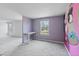 Bedroom with purple walls and a large mural at 7228 Pecan Tree St, Willow Springs, NC 27592
