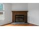 Cozy stone fireplace with a window nearby at 7228 Pecan Tree St, Willow Springs, NC 27592