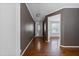 Hardwood floor hallway with a view into another room at 7228 Pecan Tree St, Willow Springs, NC 27592