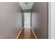 Hardwood floor hallway with dark walls and light trim at 7228 Pecan Tree St, Willow Springs, NC 27592