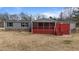 Gray house exterior with red deck and hot tub at 7228 Pecan Tree St, Willow Springs, NC 27592