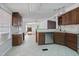 Open concept kitchen with island and view of living room at 7228 Pecan Tree St, Willow Springs, NC 27592