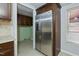 Kitchen features stainless steel refrigerator and pantry at 7228 Pecan Tree St, Willow Springs, NC 27592