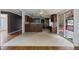 Open kitchen with island and access to screened porch at 7228 Pecan Tree St, Willow Springs, NC 27592