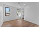 Bright bedroom featuring light hardwood floors and a spacious closet at 808 Culpepper Ln, Raleigh, NC 27610