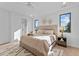 Bright bedroom with hardwood floors and large windows at 808 Culpepper Ln, Raleigh, NC 27610