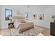 Spacious bedroom with light walls, hardwood floors, and large windows at 808 Culpepper Ln, Raleigh, NC 27610