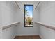 Bright walk-in closet with window and ample hanging space at 808 Culpepper Ln, Raleigh, NC 27610