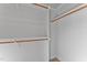 Spacious walk-in closet with wood shelving and ample hanging space at 808 Culpepper Ln, Raleigh, NC 27610