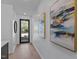 Bright entryway with light wood floors and modern artwork at 808 Culpepper Ln, Raleigh, NC 27610
