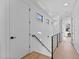 Bright hallway with light walls and hardwood floors at 808 Culpepper Ln, Raleigh, NC 27610