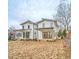 Two-story modern farmhouse style home with covered patio at 808 Culpepper Ln, Raleigh, NC 27610