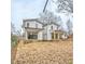 Rear view of two-story modern farmhouse style home at 808 Culpepper Ln, Raleigh, NC 27610