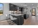 Modern kitchen with dark cabinetry, quartz countertops, and island seating at 808 Culpepper Ln, Raleigh, NC 27610