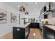 Modern kitchen with island, stainless steel appliances, and dark cabinetry at 808 Culpepper Ln, Raleigh, NC 27610