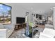 Open living space with hardwood floors and views of the kitchen at 808 Culpepper Ln, Raleigh, NC 27610