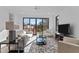 Spacious living room featuring hardwood floors and sliding glass doors to a deck at 808 Culpepper Ln, Raleigh, NC 27610