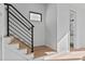 Modern staircase with metal railing leading to upper level at 808 Culpepper Ln, Raleigh, NC 27610