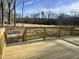 Wooden deck with forest view, perfect for relaxation and enjoying the natural surroundings at 810 Maggie Way, Wendell, NC 27591