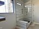 Spa-like bathroom with walk-in shower and marble tile at 828 Maggie Way, Wendell, NC 27591