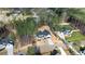 Aerial view of the house in a neighborhood surrounded by lots of trees and greenery at 85 Arbor Dr, Youngsville, NC 27596