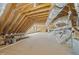 Spacious unfinished attic area with wooden beams and ductwork, ideal for future expansion at 85 Arbor Dr, Youngsville, NC 27596
