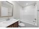 Bathroom featuring single sink vanity and shower over tub combo at 85 Arbor Dr, Youngsville, NC 27596