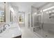 Bathroom featuring double sink vanity, tile floors and tile shower with glass door at 85 Arbor Dr, Youngsville, NC 27596