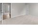 Bright bedroom featuring plush carpeting, neutral walls, and a door to another living space at 85 Arbor Dr, Youngsville, NC 27596