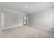Spacious carpeted bedroom with neutral walls and open door way at 85 Arbor Dr, Youngsville, NC 27596