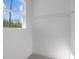 Bright closet space with a sturdy wire shelf, perfect for organized storage at 85 Arbor Dr, Youngsville, NC 27596