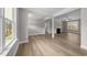 Spacious living room boasting hardwood floors, neutral paint, fireplace, and natural light at 85 Arbor Dr, Youngsville, NC 27596