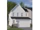 Two-story home with white siding, a brick base, and a two-car garage at 8945 Kennebec Crossing Drive # 54, Angier, NC 27501